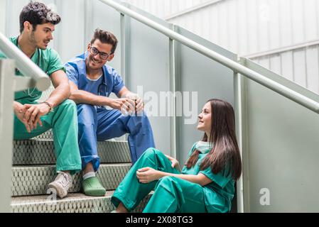 Medics having coffee and watching tablet Stock Photo