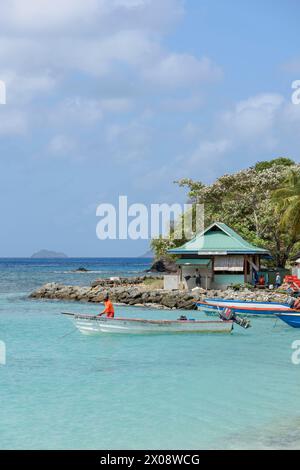 Fishing boats moored in Britannia Bay, Lovell Village, Mustique Island, St Vincent & the Grenadines, Caribbean Stock Photo