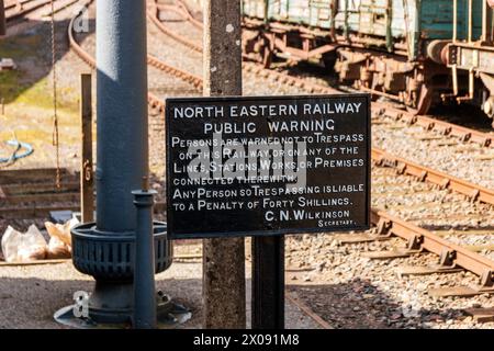 Trespass sign. Kirkby Stephen East, Stainmore Railway. Stock Photo