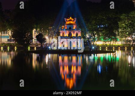 HANOI, VIETNAM - JANUARY 10, 2016: Turtle Tower on Hoan Kiem Lake in the spotlight. The historic center of Hanoi Stock Photo