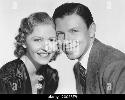 Josephine Hutchinson, George Murphy, on-set of the film, 'he Women Men Marry', MGM, 1937 Stock Photo