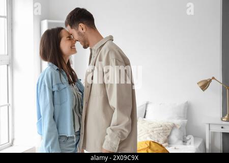 Happy tourists checking in hotel room Stock Photo