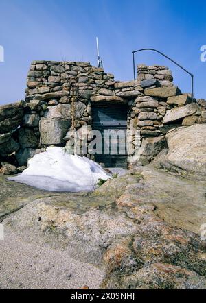 Middle Sister Groundhouse (fire tower) on Middle Sister Mountain in Albany, New Hampshire USA. This fire tower was in operation from 1927-1948. Stock Photo