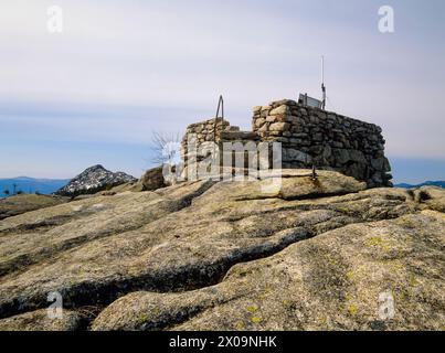 Middle Sister Groundhouse (fire tower) on Middle Sister Mountain in Albany, New Hampshire USA. This fire tower was in operation from 1927-1948. Stock Photo