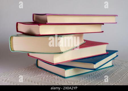 Hardback Books Stacked on White Background, 2024, Stock Photo