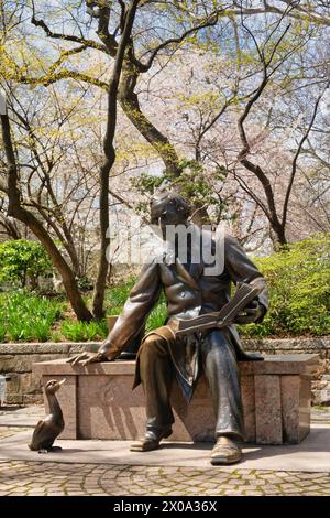 The Hans Christian Andersen sculpture is a favorite place at the Conservatory Water for children's story-time in Central Park, Nyc, USA  2024 Stock Photo