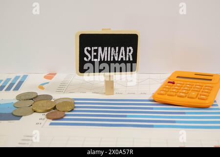 Hand writing Seminar topic on chalkboard. Stock Photo