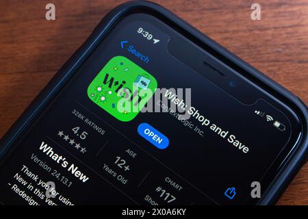 Wish app seen in App Store on an iPhone. Wish is an US online e-commerce platform for transactions between sellers and buyers Stock Photo