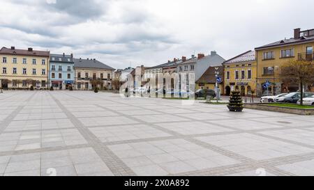 Nowy Targ, Poland - April 6, 2024: View of the north-east part of Market Square on a cloudy day Stock Photo