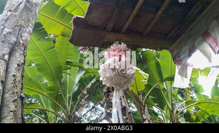 Traditional Indonesian toy for home decoration made from colorful plastic in the shape of flowers Stock Photo