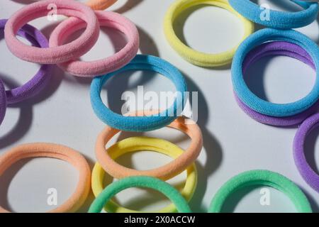 Heap of various hair ties. multicolored elastics isolated  on white background Stock Photo