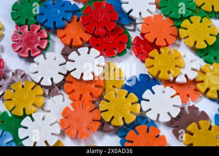 Wooden children's puzzle toy with colorful blocks of different shapes in cute star shapes. Color educational toy for children Stock Photo