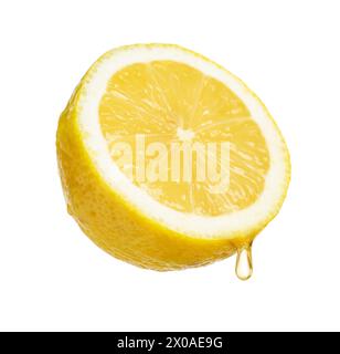 Juice dripping from half of lemon isolated on white Stock Photo