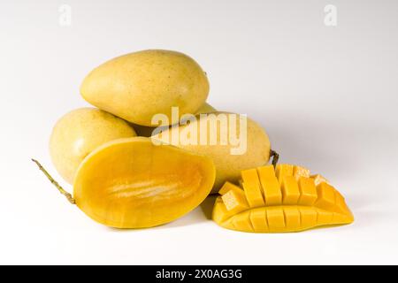 Mango fruits and mango cubes isolated on white background Stock Photo