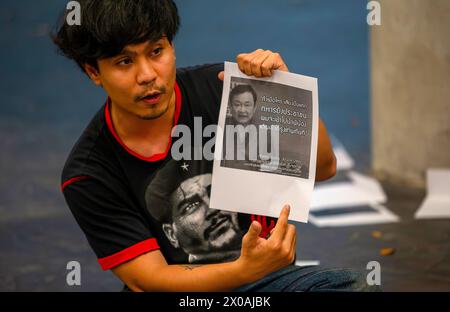 Chiang Mai, Thailand. 10th Apr, 2024. An activist holds a placard during 14th anniversary commemorative event to remember those who died from the dispersal of The United Front for Democracy Against Dictatorship (UDD) or Red Shirt protests on April 10, 2010 at Chiang Mai University. On April 10, 2010 troops moved in to clear the area as part of their marathon street rally by a deadly military crackdown in the capital that killed 91 people and injured other thousands. Credit: SOPA Images Limited/Alamy Live News Stock Photo