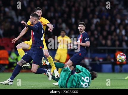 Paris, France. 10th Apr, 2024. Paris Saint-Germain's goalkeeper Gianluigi Donnarumma tries to save a goal by Raphinha (not in the picture) of FC Barcelona during the UEFA Champions League quarterfinal 1st Leg match between Paris Saint-Germain (PSG) and FC Barcelona in Paris, France, April 10, 2024. Credit: Gao Jing/Xinhua/Alamy Live News Stock Photo