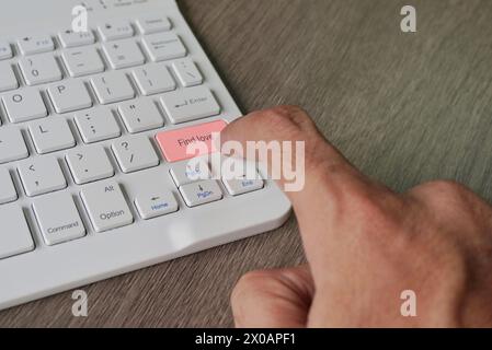 Finger pressing computer keyboard with text FIND LOVE. Online dating concept Stock Photo