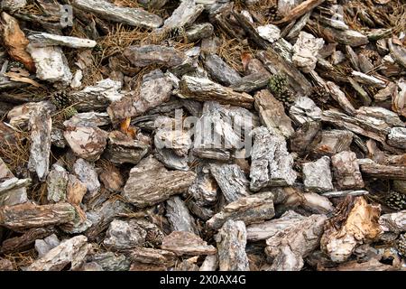 Wood chips, mixture of dark gray, light gray, and brown tones, creating a textured and natural appearance Stock Photo