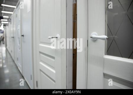 interior doors installed in a row. different doors in the hardware store Stock Photo