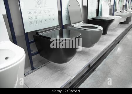 New modern black toilet  . Toilet bowls in a home goods store. Stock Photo