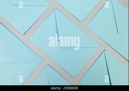 Top view of blue envelopes on grey background. Post flat lay. Copy space. Stock Photo