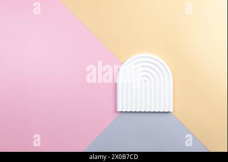 Top view of white arch on colourful background. Blue, pink and yellow background. Product presentation, colourful wallpaper, flat lay, copy space. Stock Photo