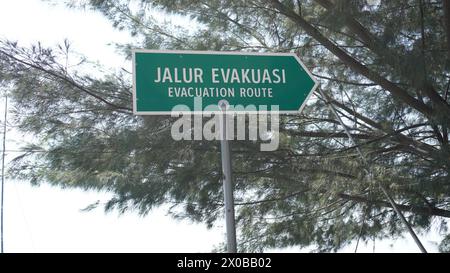 Evacuation route sign at Pasir Putih beach Situbondo Stock Photo