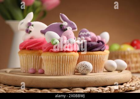 Tasty cupcakes with Easter decor on table Stock Photo
