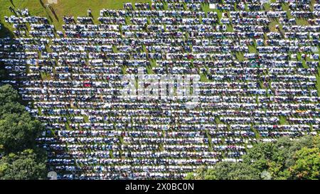 Beijing, China. 10th Apr, 2024. An aerial drone photo taken on April 10, 2024 shows people attending a prayer in celebration of Eid al-Fitr outside the Al-Azhar Great Mosque in Jakarta, Indonesia. Credit: Xu Qin/Xinhua/Alamy Live News Stock Photo