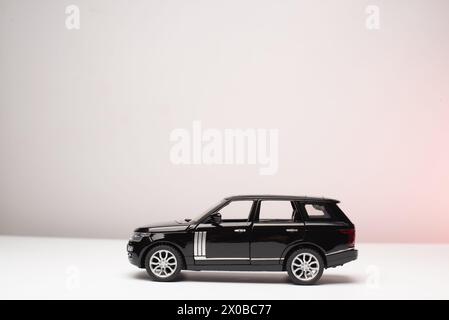 Black Toy car isolated on white background Stock Photo