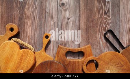 Empty cutting boards on wooden background . Stock Photo