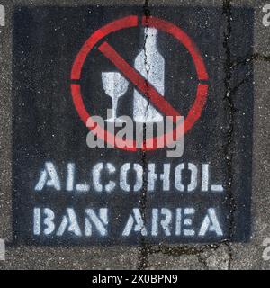 Motueka, Tasman region, south island, Aotearoa / New Zealand - January 13, 2023: Alcohol ban area sign spray painted on a pavement. Stock Photo