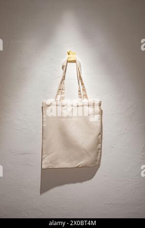 White Canvas Tote Bag on Rustic Wooden Wall Stock Photo - Alamy