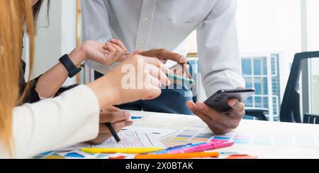 team of UI UX web designer are working together to develop mobile responsive websites with UI UX front end designer previews Stock Photo