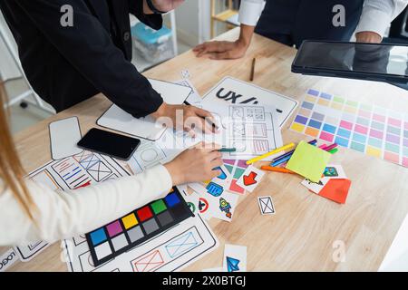 team of UI UX web designer are working together to develop mobile responsive websites with UI UX front end designer previews Stock Photo
