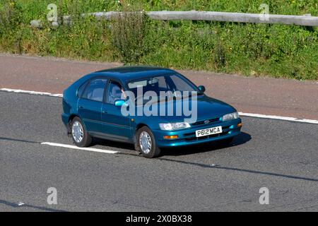 1996 90s nineties Blue Toyota Corolla Solair SE motoring in Manchester M6 UK Stock Photo