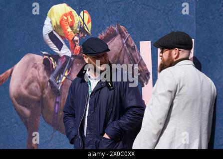 Racegoers on day one of the 2024 Randox Grand National Festival at Aintree Racecourse, Liverpool. Picture date: Thursday April 11, 2024. Stock Photo