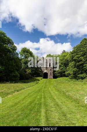 The rustic Gothic Arch mock entrance folly into the Belvedere demesne in County Westmeath, Ireland Stock Photo