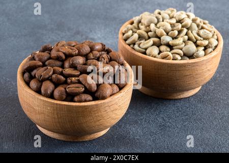 Green coffee with roasted coffee beans on black background Stock Photo
