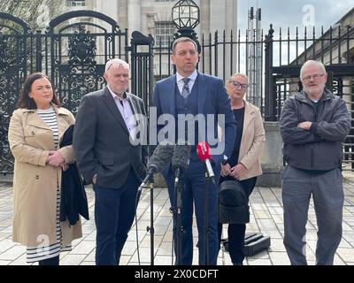 Solicitor Padraig O Muirigh (centre) with members of the families of Peter Ryan (known as Michael) and Tony Doris, two of the three men killed by the SAS during an incident at Coagh, Co Tyrone in June 1991 outside the Royal Court of Justice in Belfast where an inquest concluded the use of lethal force was justified but criticised the planning of the army operation. Picture date: Thursday April 11, 2024. Stock Photo