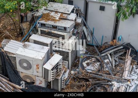 Waste air conditioning spontaneous dump with leaves in the forest. Stock Photo