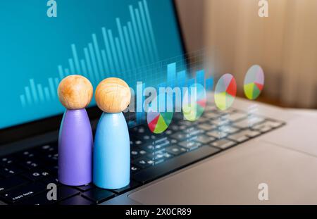 Statistics and marketing. Data about customer preferences. Products and marketing strategies. Social studies. Graphs and diagrams over the laptop. Stock Photo