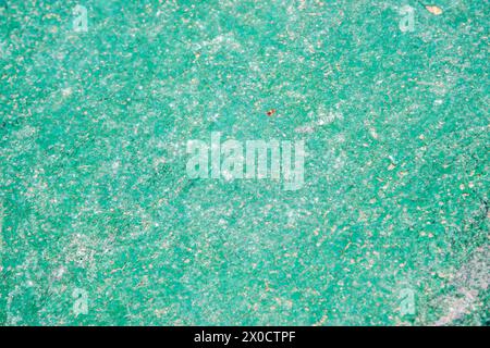 Weathered aged cracked plastic surface closeup as green grunge background Stock Photo