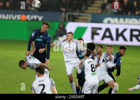 Swansea, UK. 10th Apr, 2024. Wouter Burger of Stoke City (l) has a header at goal. FL Skybet championship match, Swansea city v Stoke City at the Swansea.com Stadium in Swansea, Wales on Wednesday 10th April 2024. this image may only be used for Editorial purposes. Editorial use only, pic by Andrew Orchard/Andrew Orchard sports photography/Alamy Live news Credit: Andrew Orchard sports photography/Alamy Live News Stock Photo