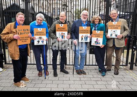 EDITORIAL USE ONLY Hosts of The Movers and Shakers podcast (left-right) Mark Mardell, Paul Mayhew-Archer, Rory Cellan-Jones, Jeremy Paxman, Gillian Lacey-Solymar and Sir Nicholas Mostyn, mark World Parkinson's Day by handing in their 'Parky Charter' petition to Downing Street, asking for more support for people with the condition. Picture date: Thursday April 11, 2024. Stock Photo