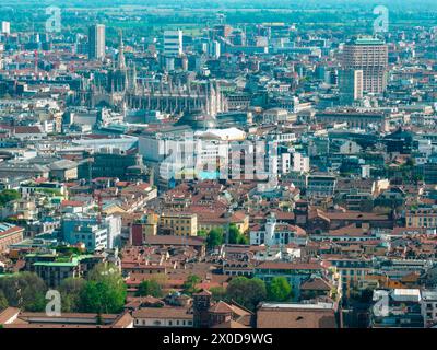 Aerial view of the Milan Cathedral. Duomo di Milano. Cathedral in white marble. Buttresses, pinnacles and spiers. Statue of the Madonnina. Italy Stock Photo