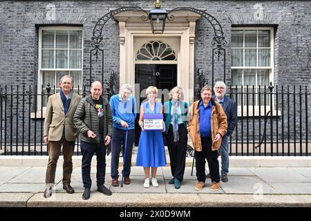 EDITORIAL USE ONLY Hosts of The Movers and Shakers podcast (left-right) Sir Nicholas Mostyn, Rory Cellan-Jones, Paul Mayhew-Archer, Gillian Lacey-Solymar Mark Mardell and Jeremy Paxman with Parkinson's UK CEO Caroline Rassell (centre), mark World Parkinson's Day by handing in their 'Parky Charter' petition to Downing Street, asking for more support for people with the condition. Picture date: Thursday April 11, 2024. Stock Photo