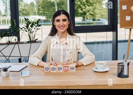 A businesswoman sitting at a table, surrounded by blocks, pondering her next move in the world of franchises. Stock Photo