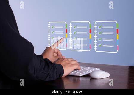 businessman manages his documents from his office. check list hologram Stock Photo