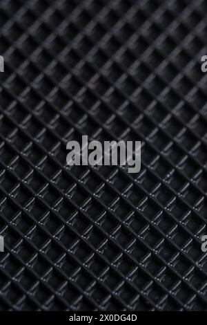 Close up of a black carbon fiber as a background. Macro Stock Photo